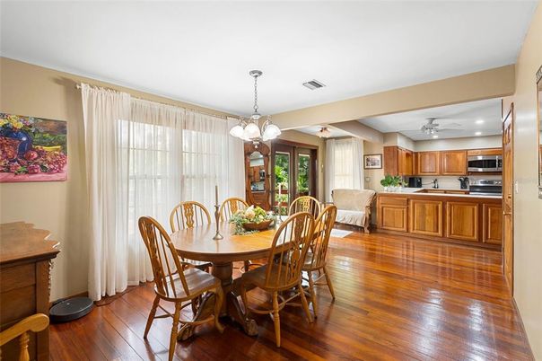 Chandelier, Dining room, Interior, Kitchen, Pendant Lights, Recessed Lighting, Stainless Steel Appliances, Wood Texture Flooring