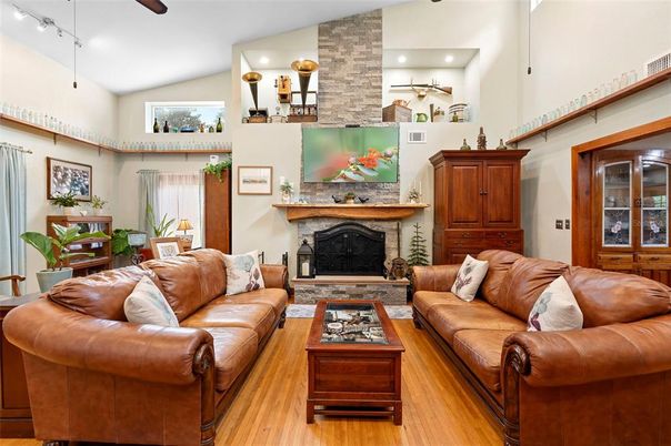 Fireplace, Interior, Living room, Recessed Lighting, Stone Walls, Wood Texture Flooring