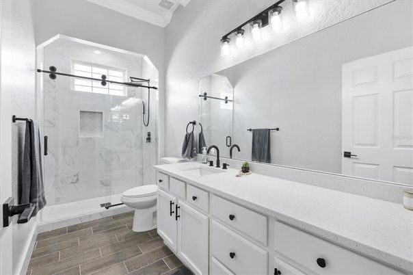 Bathroom, Dual Sink Vanities, Glass Shower, Interior, Marble Walls, Wood Texture Flooring
