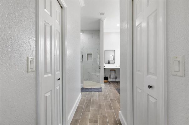 Bathroom, Glass Shower, Interior, Marble Walls, Recessed Lighting, Wood Texture Flooring