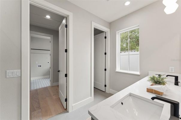Bathroom, Dual Sink Vanities, Interior, Recessed Lighting, Wood Texture Flooring