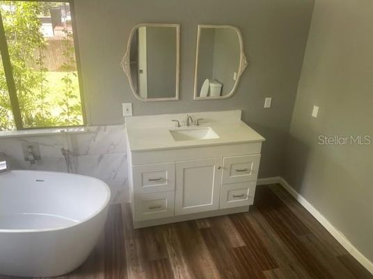 Bathroom, Dual Sink Vanities, Free Standing Baths, Interior, Wood Texture Flooring