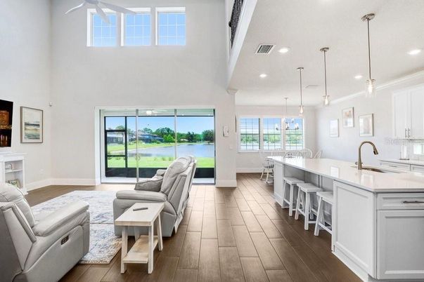 Fireplace, Interior, Kitchen, Living room, Pendant Lights, Recessed Lighting, Water, Wood Texture Flooring