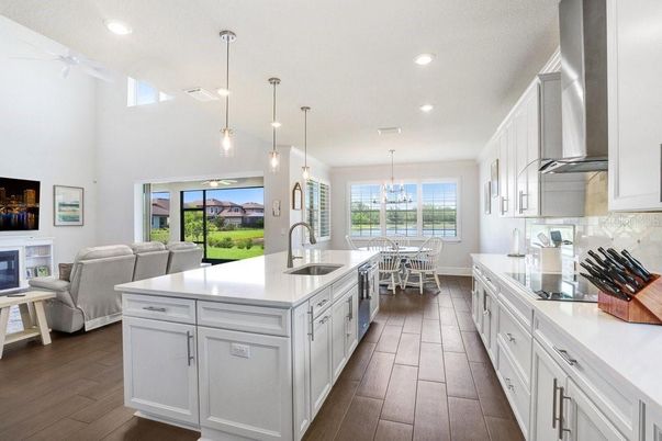 Chandelier, Dining room, Interior, Kitchen, Living room, Pendant Lights, Recessed Lighting, Wood Texture Flooring