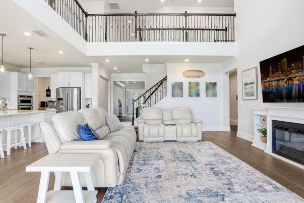 Fireplace, Interior, Kitchen, Living room, Pendant Lights, Recessed Lighting, Stainless Steel Appliances, Wood Texture Flooring