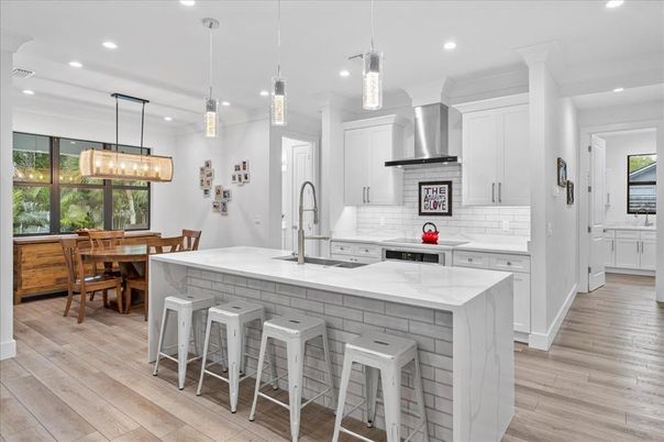 Dining room, Interior, Kitchen, Pendant Lights, Recessed Lighting, Stainless Steel Appliances, Wood Texture Flooring
