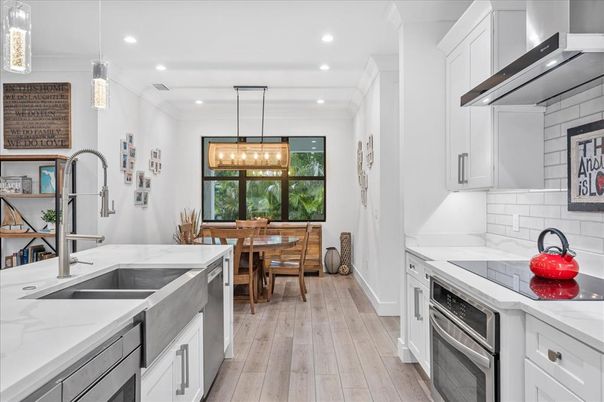 Dining room, Interior, Kitchen, Pendant Lights, Recessed Lighting, Stainless Steel Appliances, Wood Texture Flooring