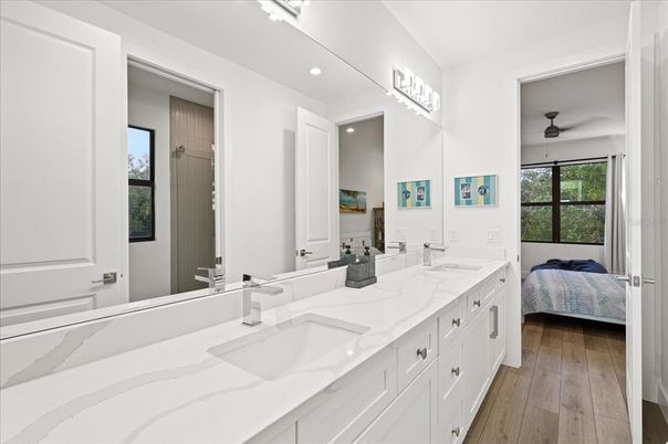 Bathroom, Dual Sink Vanities, Interior, Recessed Lighting, Wood Texture Flooring