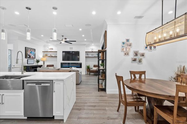 Dining room, Interior, Kitchen, Living room, Pendant Lights, Recessed Lighting, Stainless Steel Appliances, Wood Texture Flooring
