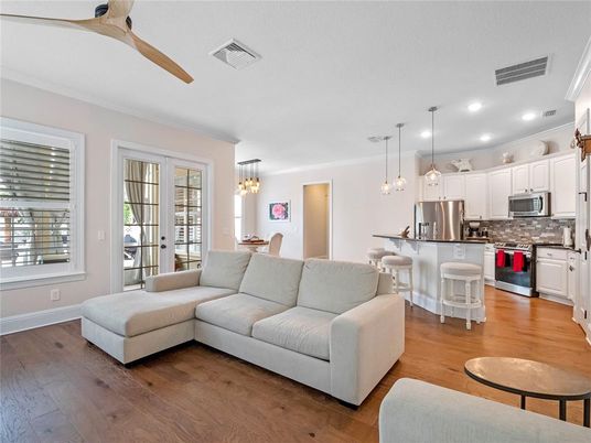 Chandelier, Dining room, Interior, Kitchen, Living room, Pendant Lights, Recessed Lighting, Stainless Steel Appliances, Wood Texture Flooring
