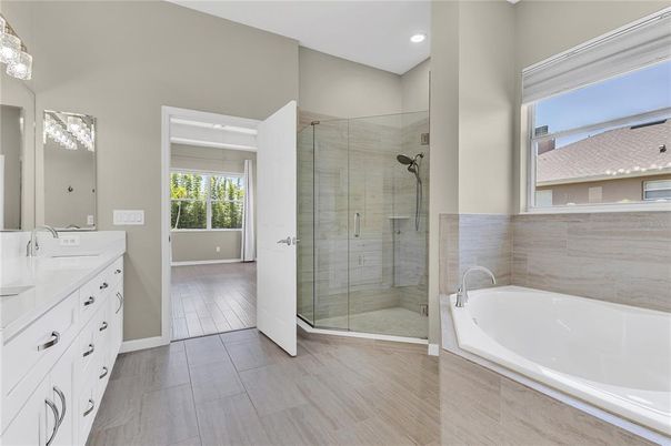 Bathroom, Dual Sink Vanities, Glass Shower, Interior, Recessed Lighting, Wood Texture Flooring