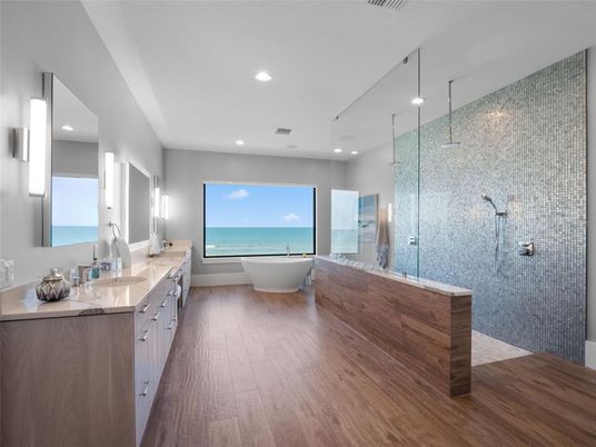 Bathroom, Dual Sink Vanities, Free Standing Baths, Glass Shower, Interior, Recessed Lighting, Water, Wood Texture Flooring