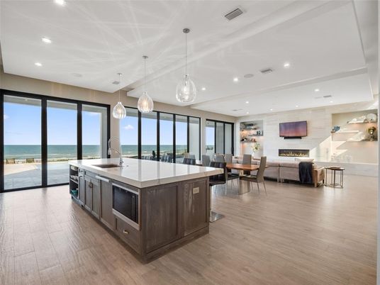 Dining room, Fireplace, Interior, Kitchen, Living room, Pendant Lights, Recessed Lighting, Water, Wood Texture Flooring