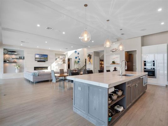 Dining room, Fireplace, Interior, Kitchen, Living room, Pendant Lights, Recessed Lighting, Stainless Steel Appliances, Wood Texture Flooring