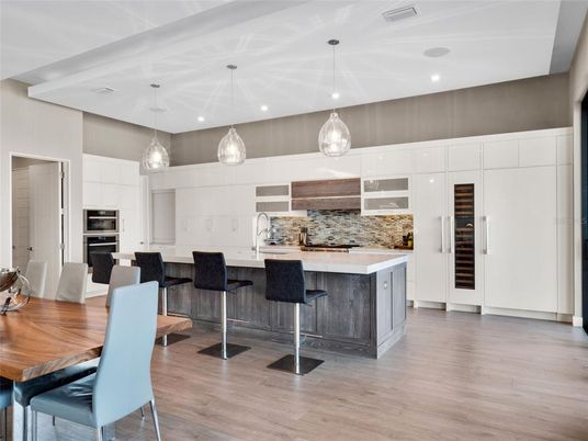 Dining room, Interior, Kitchen, Pendant Lights, Recessed Lighting, Stainless Steel Appliances, Wood Texture Flooring