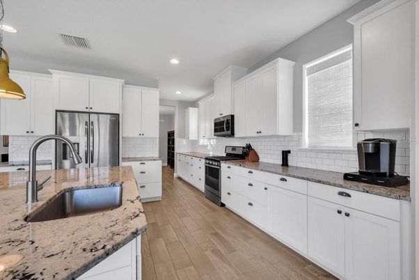 Interior, Kitchen, Recessed Lighting, Stainless Steel Appliances, Wood Texture Flooring