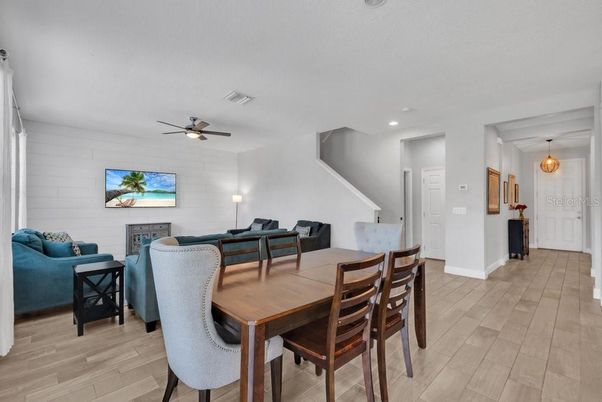 Dining room, Fireplace, Interior, Living room, Pendant Lights, Recessed Lighting, Wood Texture Flooring