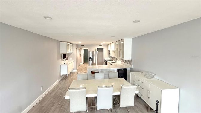 Dining room, Interior, Kitchen, Recessed Lighting, Stainless Steel Appliances, Wood Texture Flooring