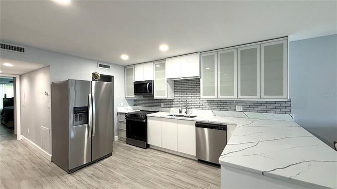 Interior, Kitchen, Recessed Lighting, Stainless Steel Appliances, Wood Texture Flooring