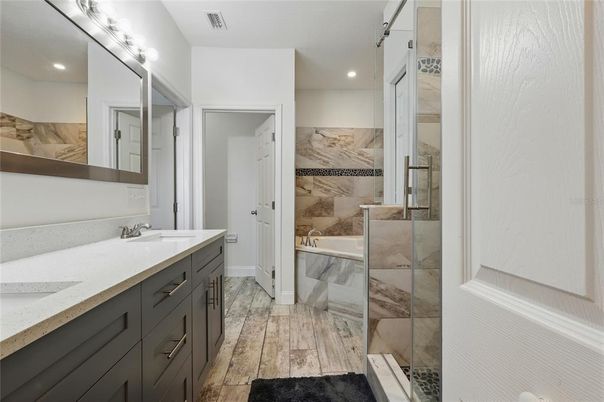 Bathroom, Dual Sink Vanities, Glass Shower, Interior, Recessed Lighting, Wood Texture Flooring