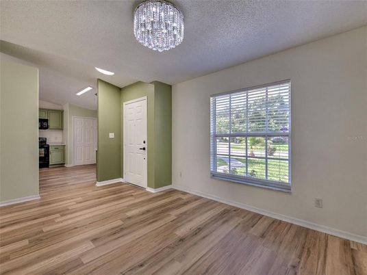 Chandelier, Empty room, Interior, Kitchen, Recessed Lighting, Wood Texture Flooring