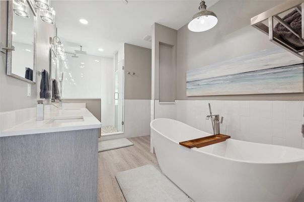 Bathroom, Dual Sink Vanities, Free Standing Baths, Glass Shower, Interior, Recessed Lighting, Wood Texture Flooring
