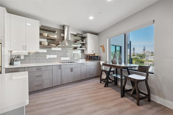 Dining room, Interior, Kitchen, Recessed Lighting, Stainless Steel Appliances, Wood Texture Flooring
