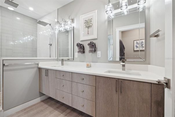 Bathroom, Dual Sink Vanities, Glass Shower, Interior, Recessed Lighting, Wood Texture Flooring