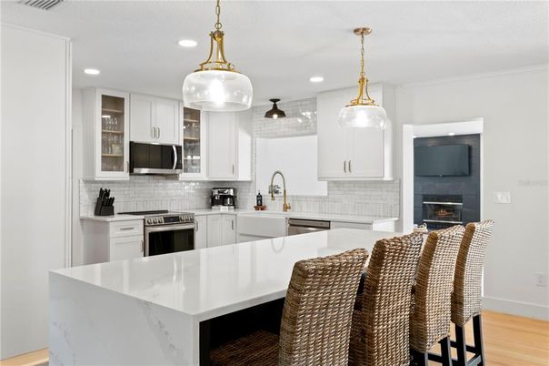 Fireplace, Interior, Kitchen, Pendant Lights, Recessed Lighting, Stainless Steel Appliances, Wood Texture Flooring