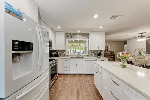 Dining room, Interior, Kitchen, Recessed Lighting, Stainless Steel Appliances, Wood Texture Flooring
