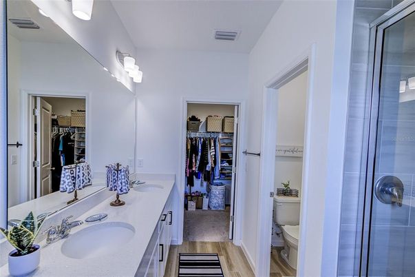 Bathroom, Dual Sink Vanities, Glass Shower, Interior, Walk-in Closets, Wood Texture Flooring