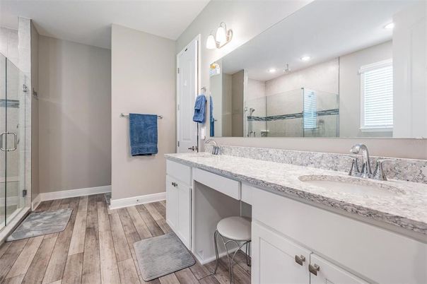 Bathroom, Dual Sink Vanities, Glass Shower, Interior, Recessed Lighting, Wood Texture Flooring