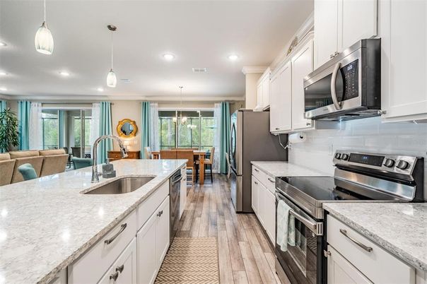 Dining room, Interior, Kitchen, Pendant Lights, Recessed Lighting, Stainless Steel Appliances, Wood Texture Flooring