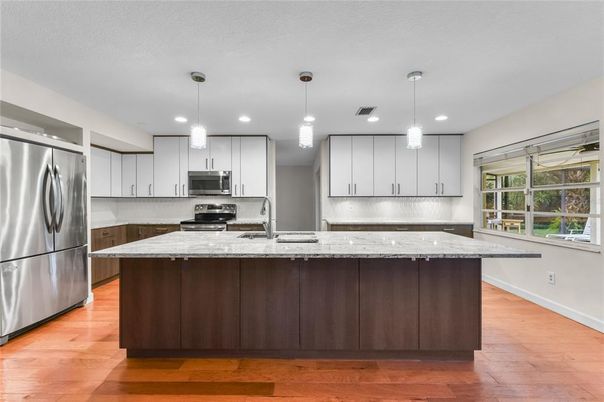 Interior, Kitchen, Pendant Lights, Recessed Lighting, Stainless Steel Appliances, Wood Texture Flooring
