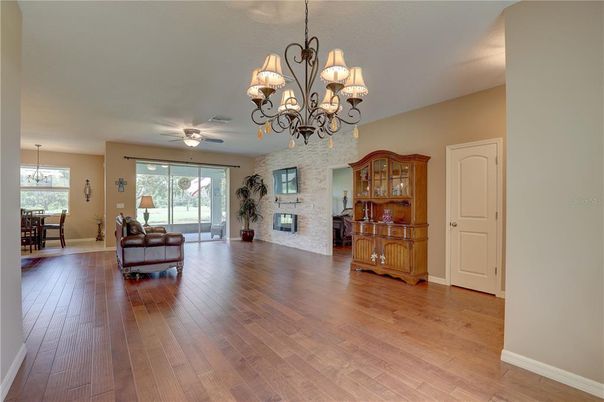 Chandelier, Dining room, Fireplace, Interior, Stone Walls, Wood Texture Flooring