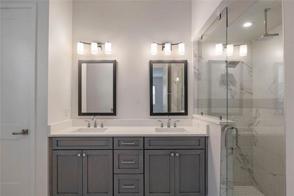 Bathroom, Dual Sink Vanities, Glass Shower, Interior, Marble Walls, Recessed Lighting
