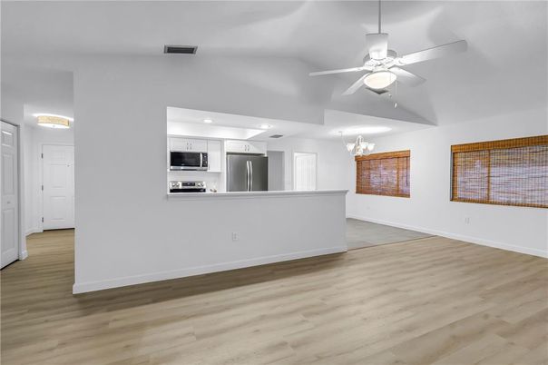 Empty room, Interior, Kitchen, Stainless Steel Appliances, Wood Texture Flooring
