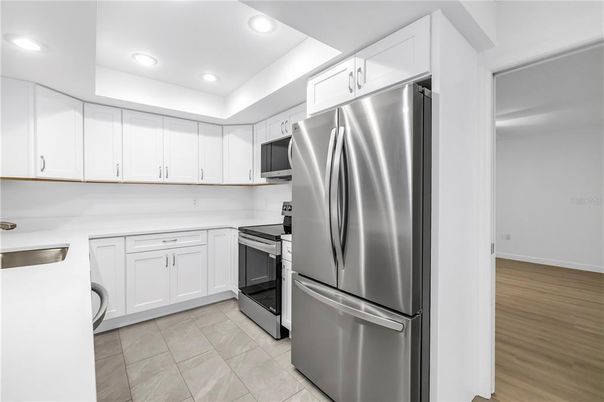 Interior, Kitchen, Recessed Lighting, Stainless Steel Appliances, Wood Texture Flooring