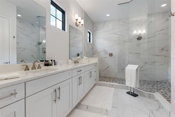 Bathroom, Dual Sink Vanities, Glass Shower, Interior, Marble, Marble Walls, Recessed Lighting