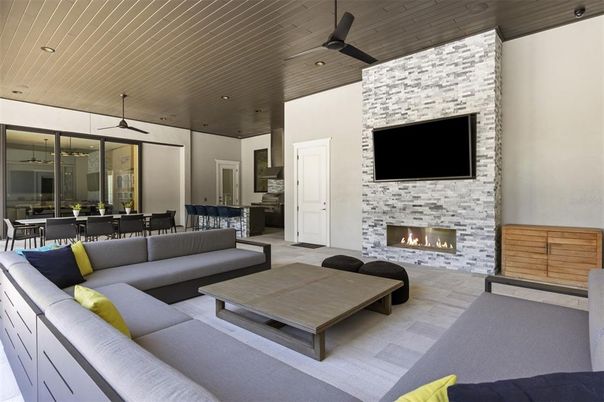 Dining room, Fireplace, Interior, Living room, Recessed Lighting, Stone Walls, Wooden Ceilings