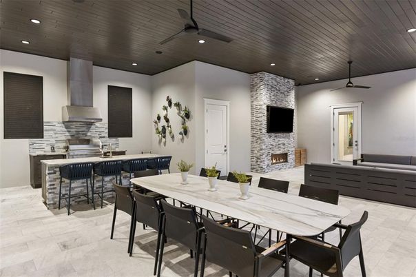 Dining room, Fireplace, Interior, Kitchen, Recessed Lighting, Stone Walls, Wooden Ceilings