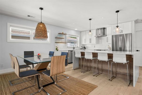 Dining room, Interior, Kitchen, Pendant Lights, Recessed Lighting, Stainless Steel Appliances, Wood Texture Flooring