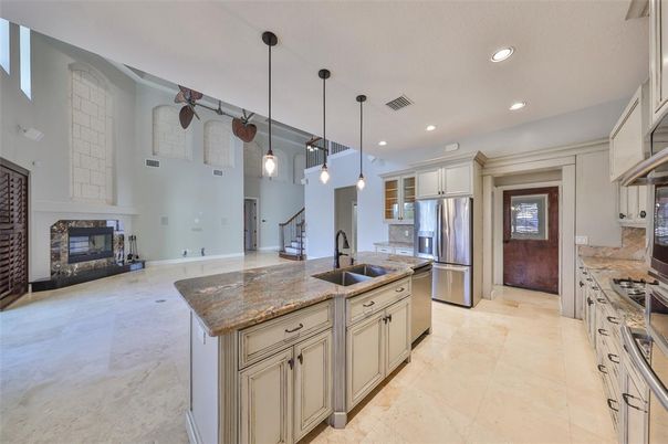 Fireplace, Interior, Kitchen, Pendant Lights, Recessed Lighting, Stainless Steel Appliances