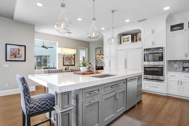 Dining room, Interior, Kitchen, Pendant Lights, Recessed Lighting, Stainless Steel Appliances, Wood Texture Flooring
