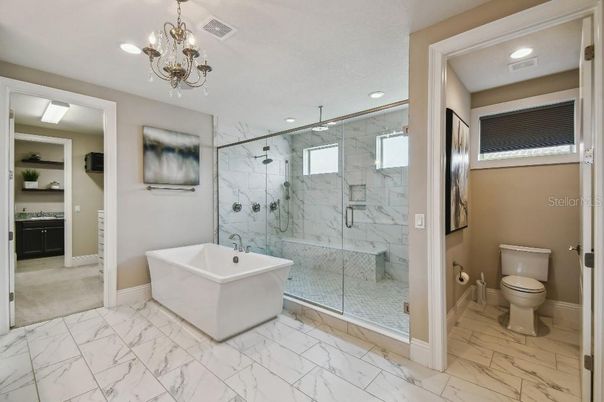 Bathroom, Chandelier, Free Standing Baths, Glass Shower, Interior, Marble, Marble Walls, Recessed Lighting