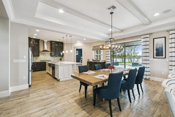 Chandelier, Dining room, Interior, Kitchen, Pendant Lights, Recessed Lighting, Stainless Steel Appliances, Wood Texture Flooring