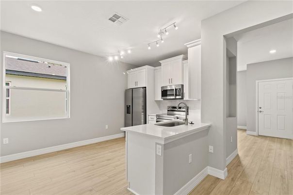 Interior, Kitchen, Recessed Lighting, Stainless Steel Appliances, Wood Texture Flooring
