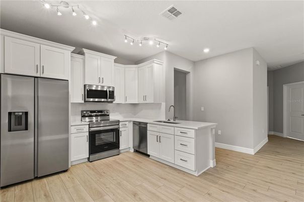 Interior, Kitchen, Recessed Lighting, Stainless Steel Appliances, Wood Texture Flooring