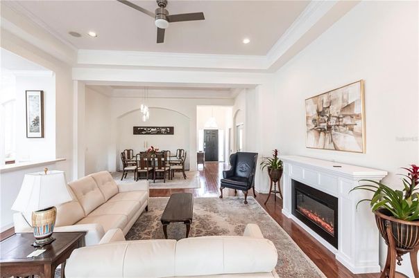 Dining room, Fireplace, Interior, Living room, Pendant Lights, Recessed Lighting, Wood Texture Flooring