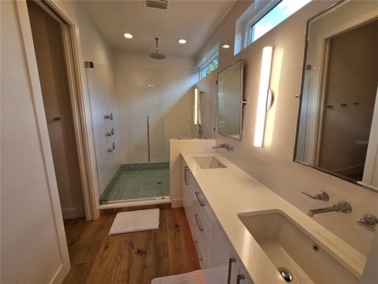 Bathroom, Dual Sink Vanities, Glass Shower, Interior, Recessed Lighting, Wood Texture Flooring